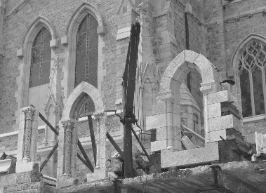 Side by side stand two windows for the council chamber; but one is of stone, the other of plaster …the latter 'finished' in more detail. The windows when finally set in the south wall of the Council Hall, standing between massive buttresses, give a pleasing grace.