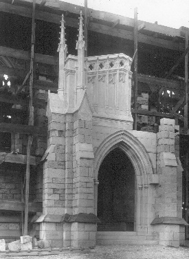 Again is seen the combined placing of finished stonework and plaster model. This is the tentative south porch, with the ornate paneling and tracery of the later gothic.