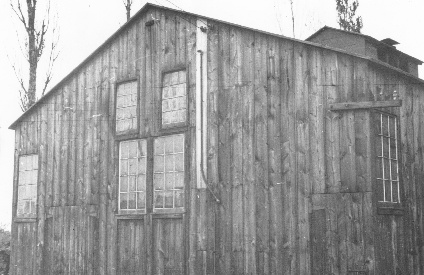 One end of the glass-making shop, situated across Huntingdon Pike from the Cathedral grounds. Its site is now a gravel parking area near the tennis courts of the Academy, where bright pieces of colored glass may still be found imbedded.