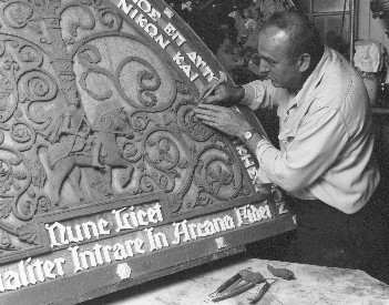 The creative endeavor still continues. This recent photograph is of the modeling of the tympanum to be placed above a new west door, of glass and monel, to replace the plain oak door hung 'temporarily' in 1919.